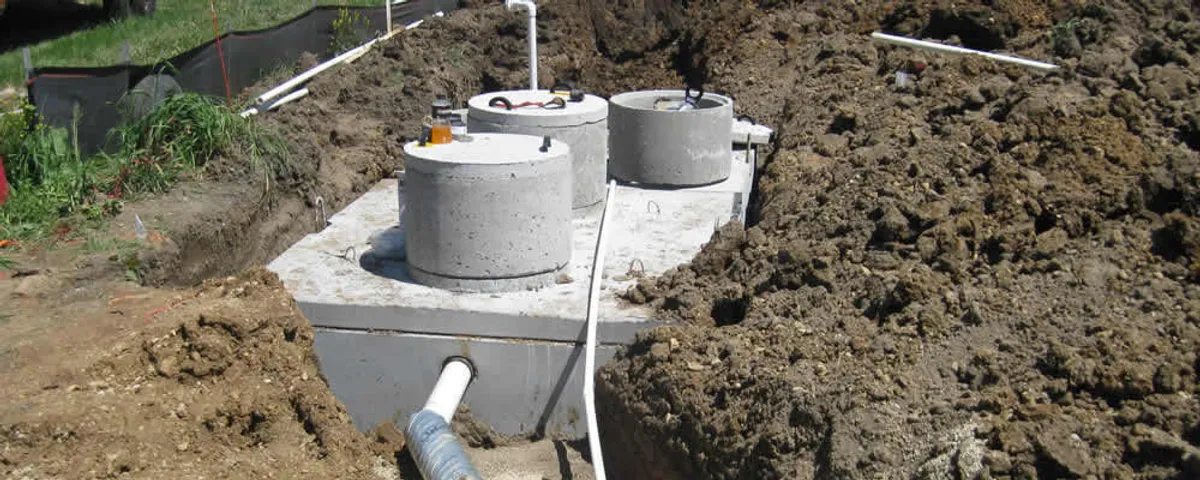 Septic system repair and installation site with tank access ports in Saint Louis, MO